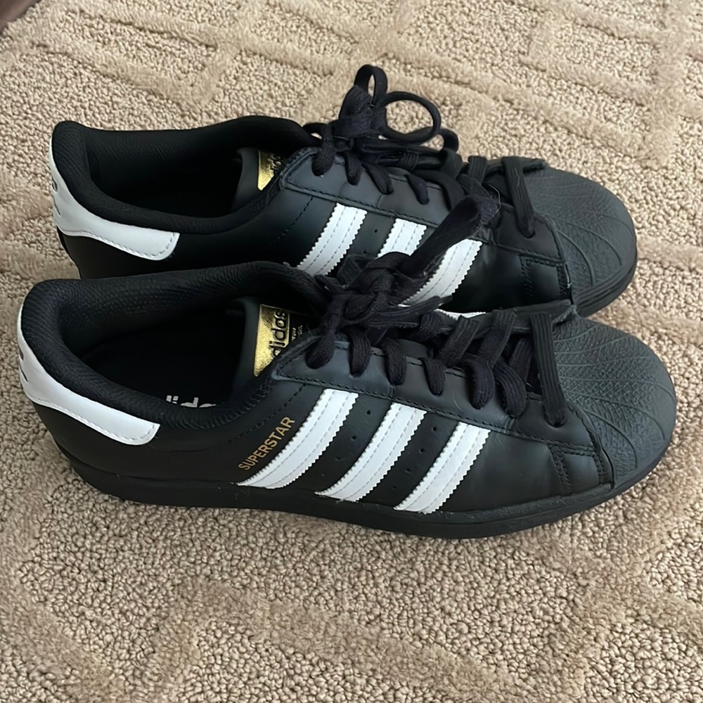 Adidas superstar sneakers.